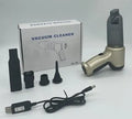 Wireless handheld car vacuum cleaner in gold or silver colour with dust bucket.