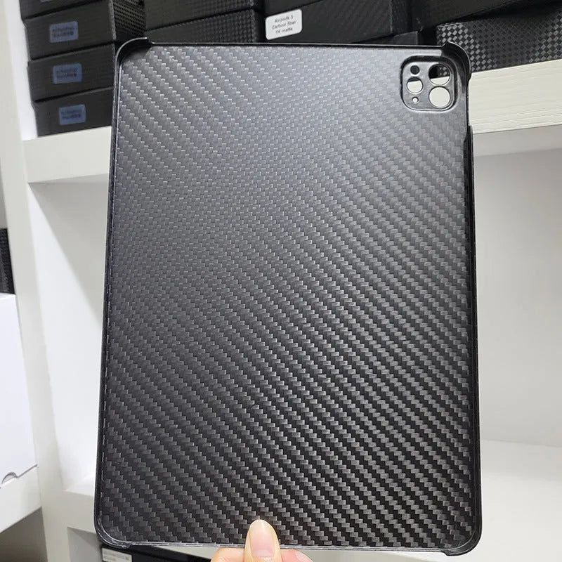 Carbon fibre hard case for Apple iPad Pro 11 showing embossed plaid pattern and matte finish.