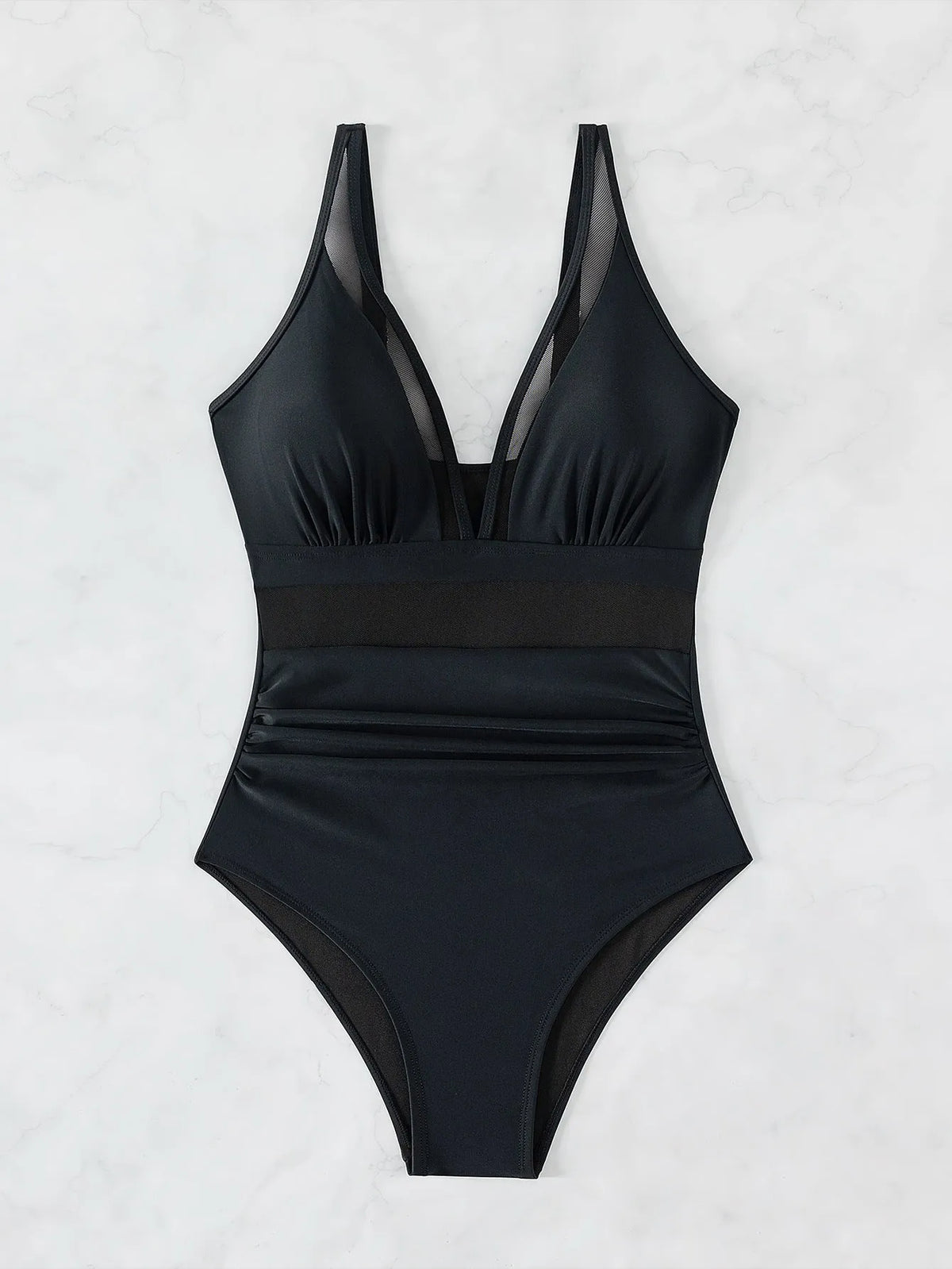 Black women's halter neck one-piece swimsuit with mesh panels and briefs style bottom.