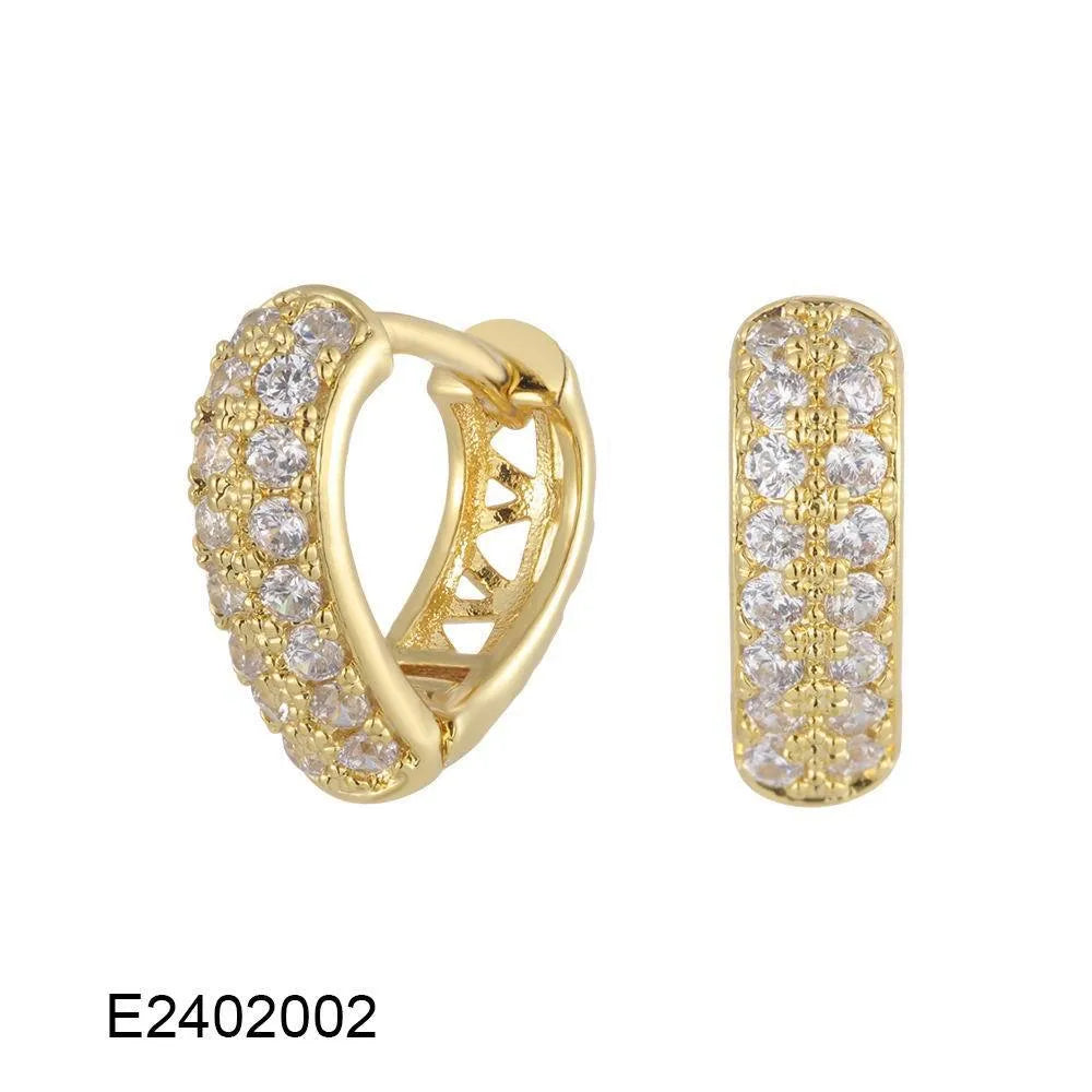 Brass gold plated heart-shaped ear clip earrings with gang drill details on copper construction