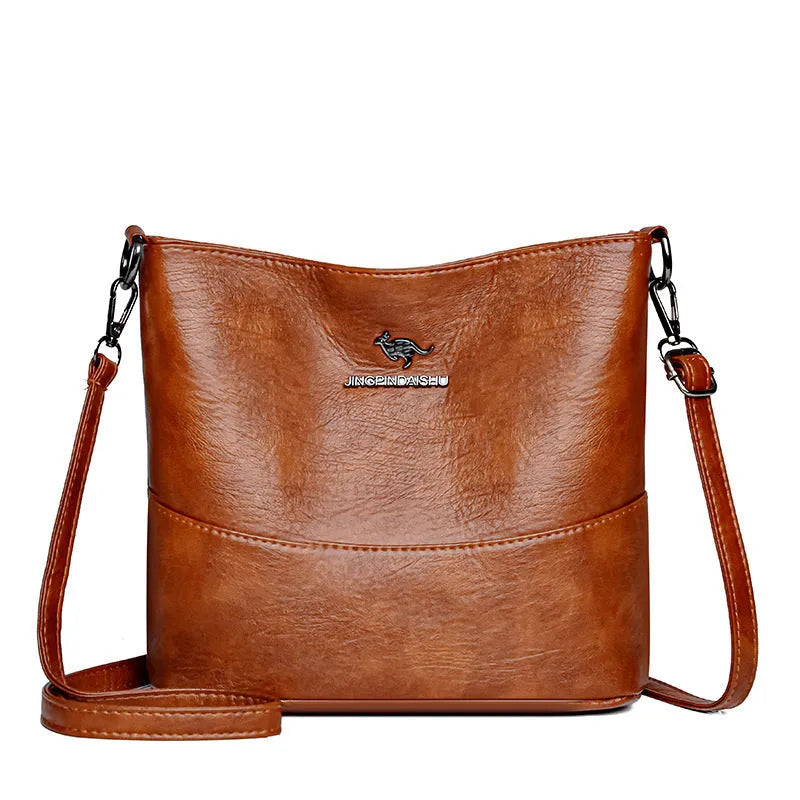 Women's leather bucket shoulder bag in solid colour with phone pocket and sandwich pockets