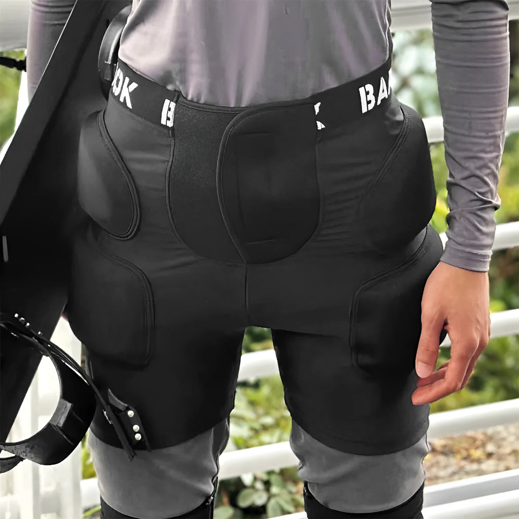 Adult black spandex hip pad pants with built-in protective padding for roller skating and skateboarding.
