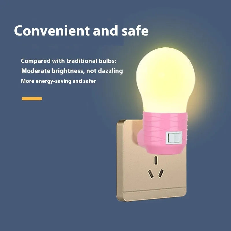 Plug-in baby night light in white shell on a nursery bedside table