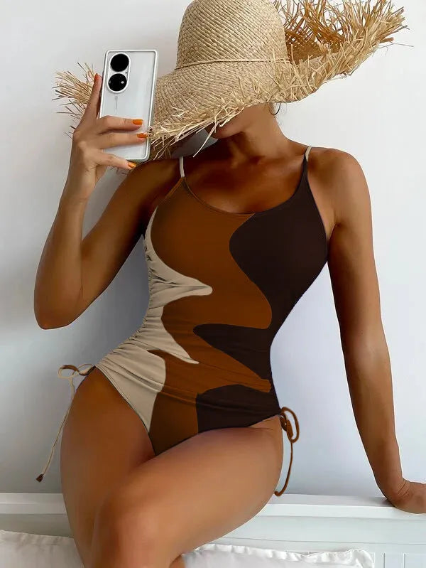 Women's blue one-piece sleeveless swimsuit with fixed swimming trunks on a mannequin.