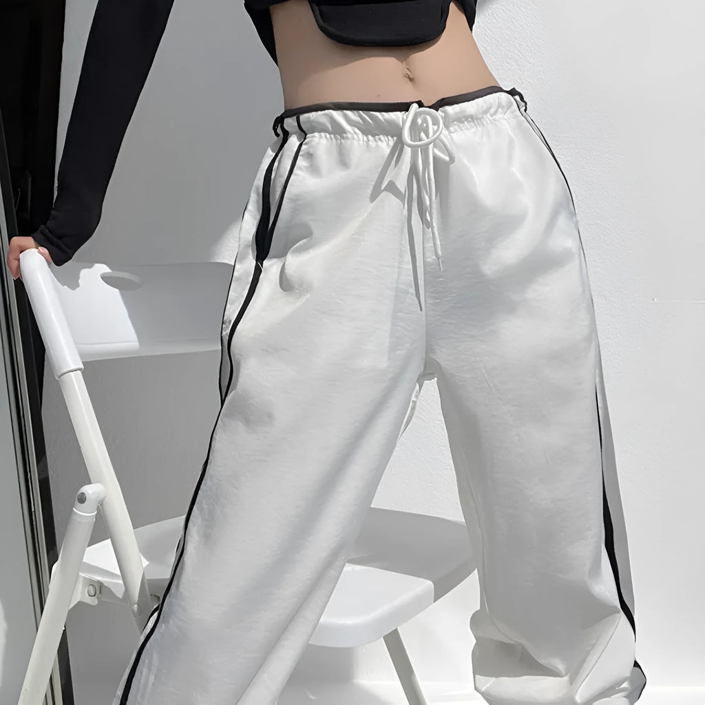 Low-waist loose straight-leg trousers with ribbon parallel bars detail in navy blue