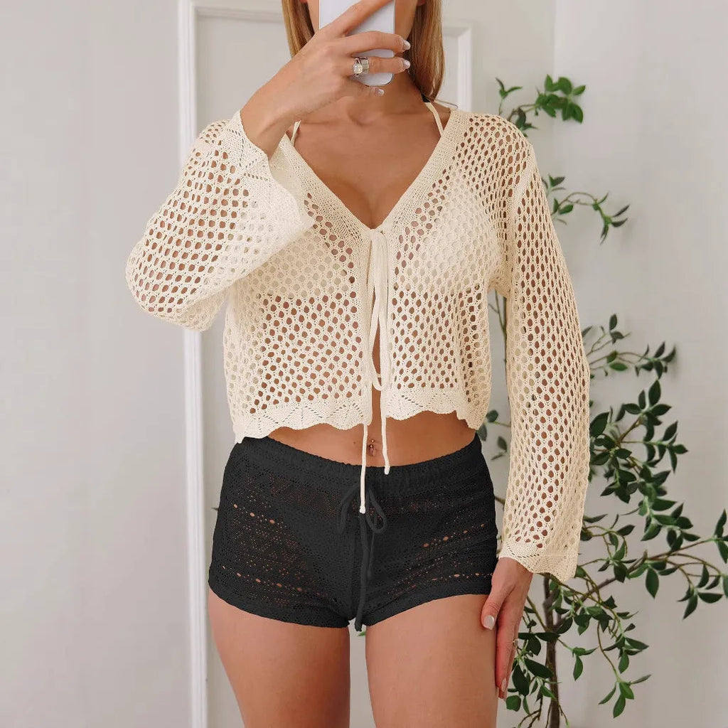 Women's apricot hollow woven cardigan blouse with short length and bell sleeves on a model