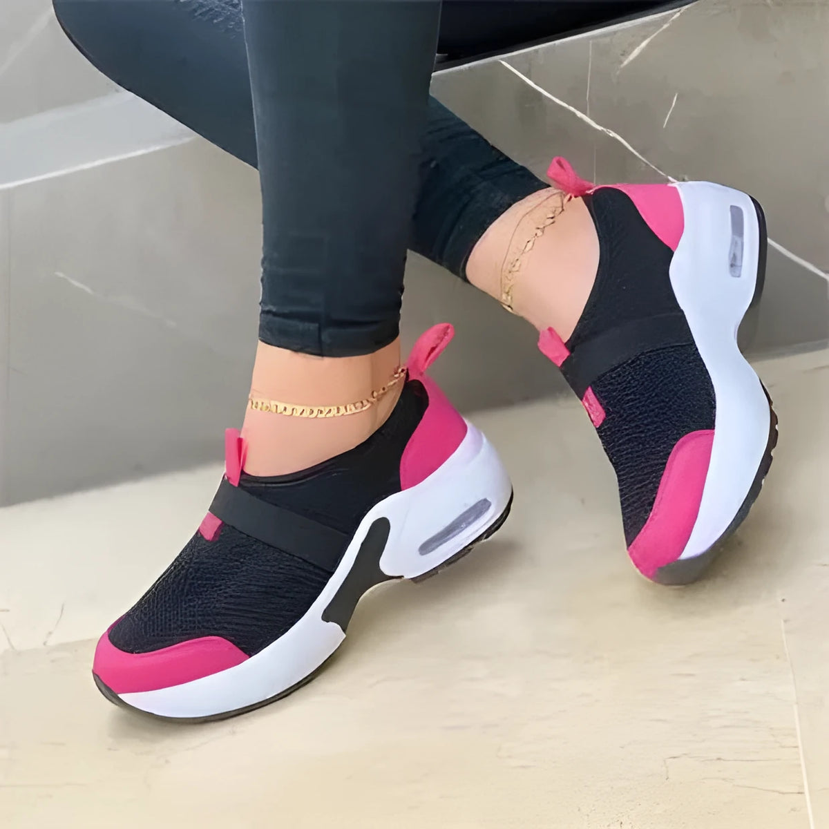 Women's flat mesh sneakers in light grey with round toe and colour stitching on a rubber sole.