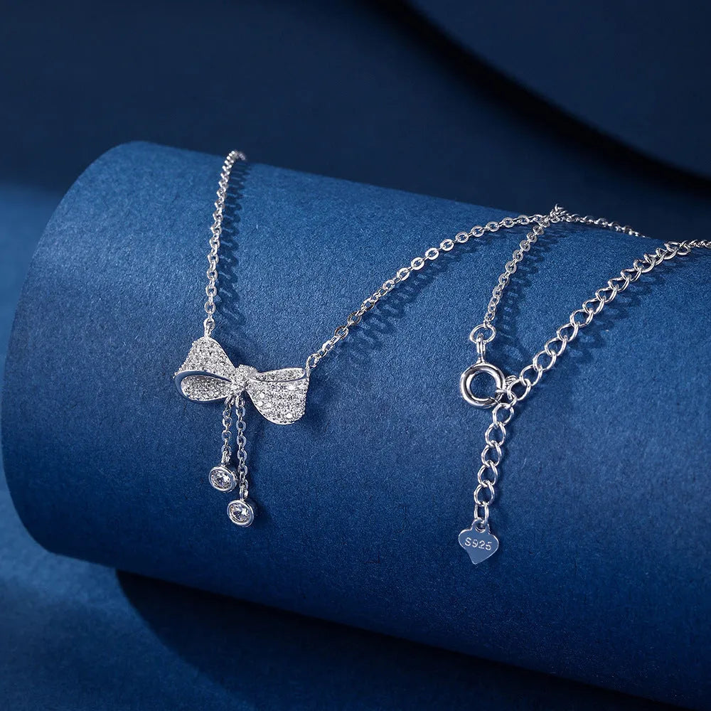 Sterling silver bow pendant necklace on O-ring chain with adjustable 40-45cm length