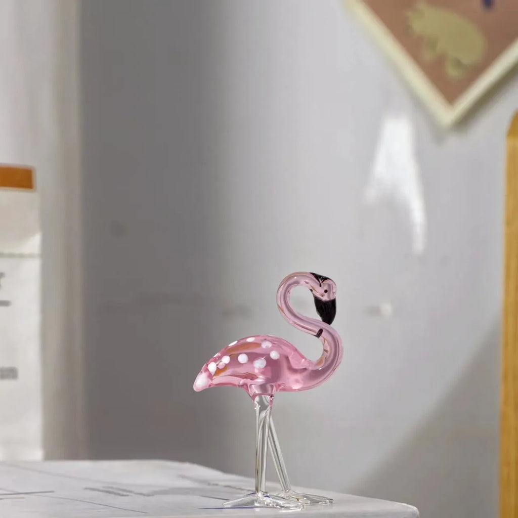 Pink and white crystal decorative flamingo table prop on a modern shelf