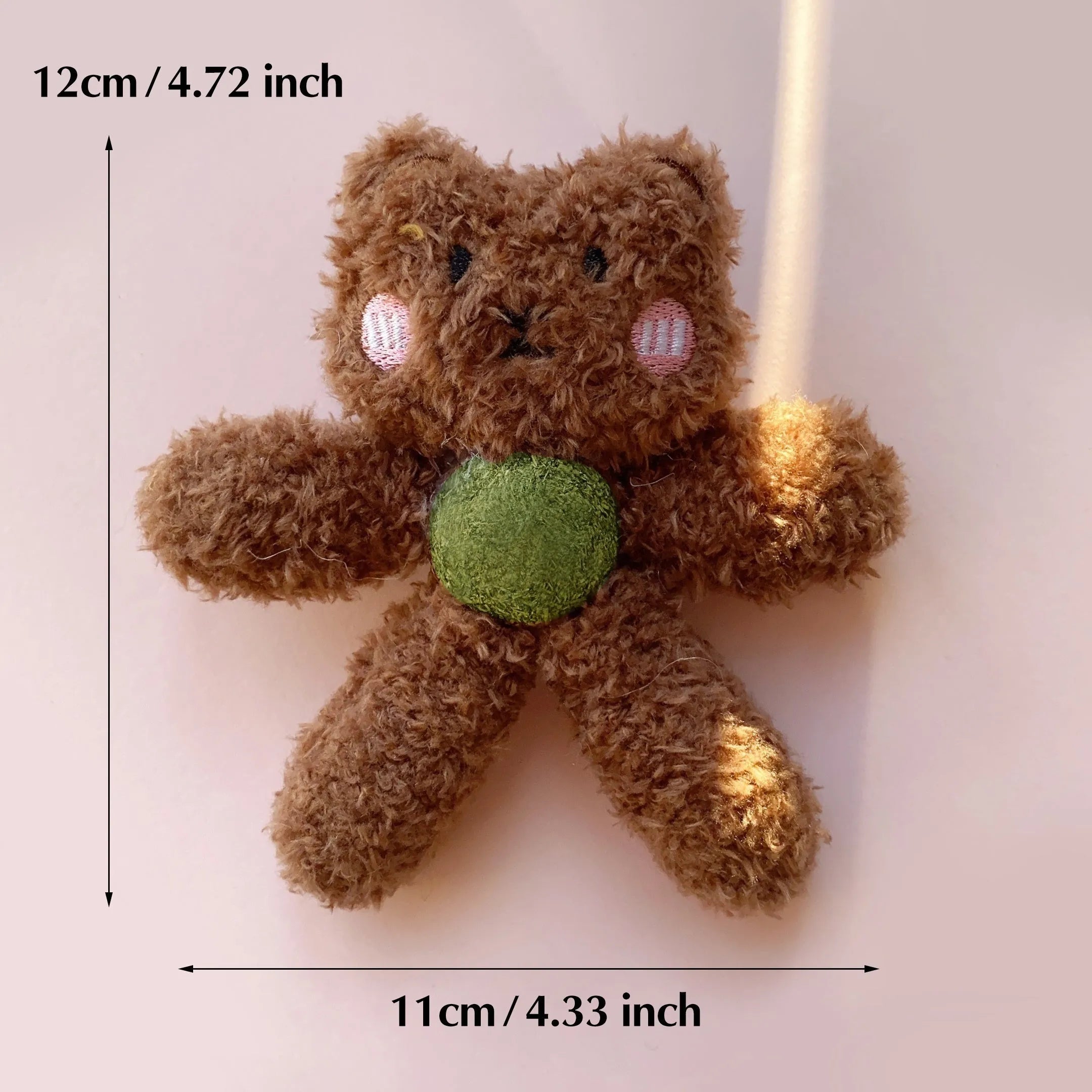 Plush catnip ball chewing toy in animal designs for dental care, showing scale next to a 12.5 cm ruler.