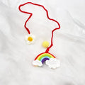 Handmade crocheted wool car pendant in avocado colour with rainbow flower design