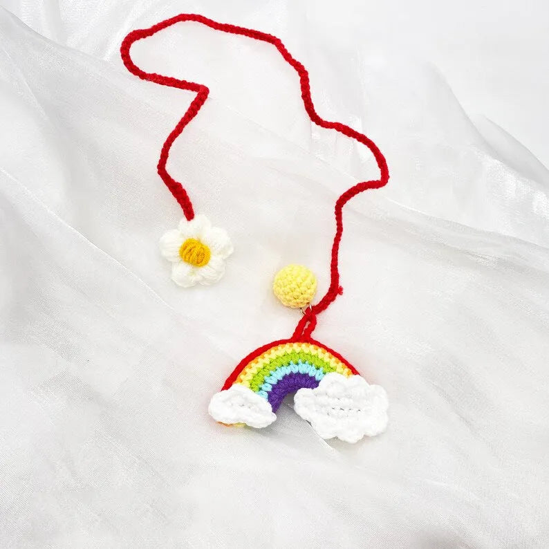 Handmade crocheted wool car pendant in avocado colour with rainbow flower design