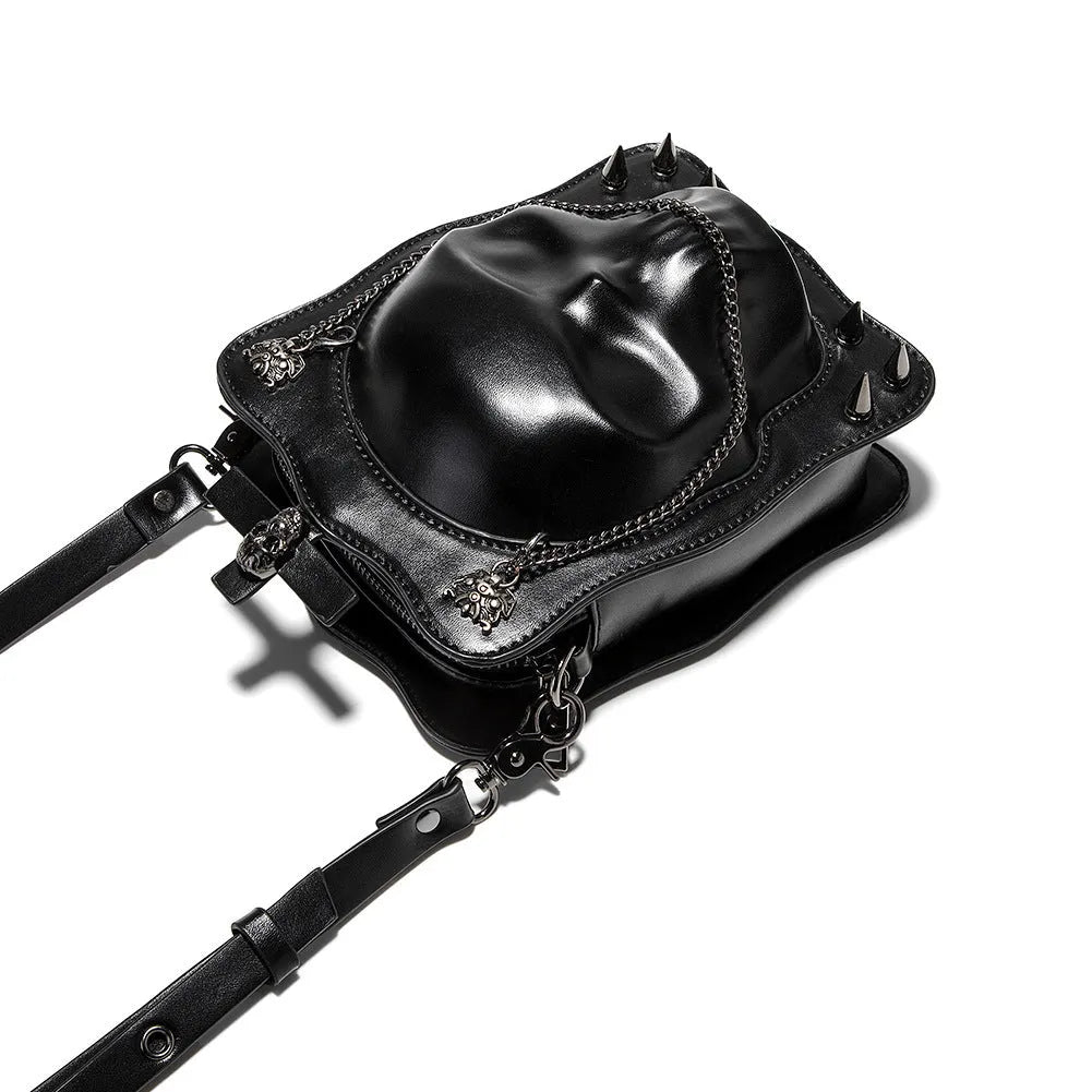 Black Halloween skull shoulder bag with embossed design, chain strap, and vertical square messenger shape