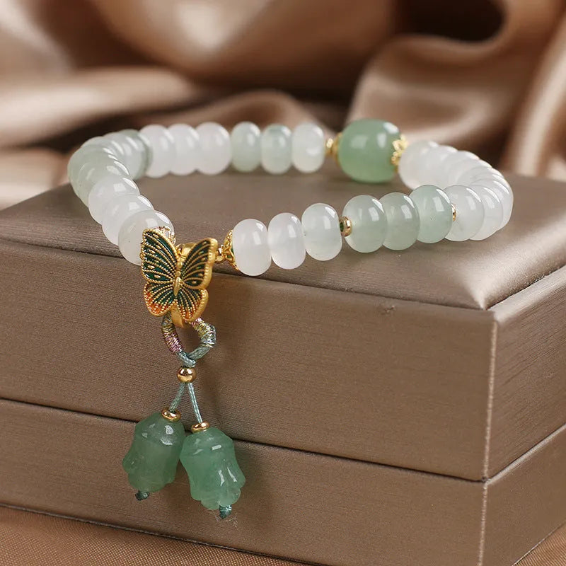 Green crystal abacus bead bracelet with butterfly tassel and pearl rhinestone decoration
