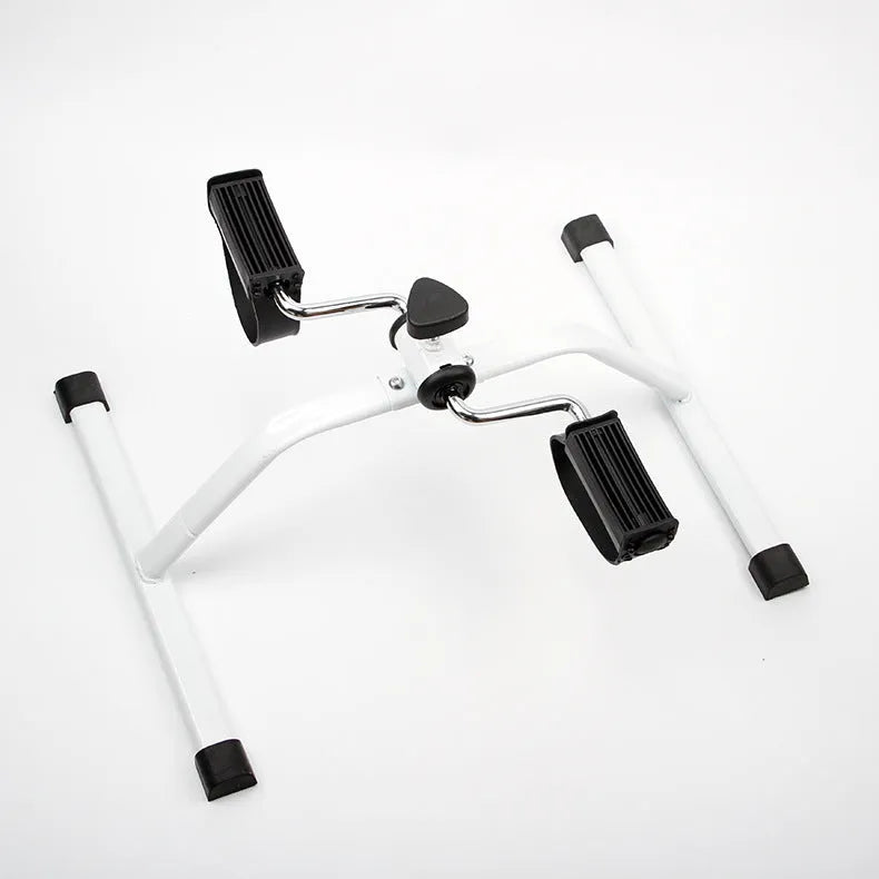 White mini exercise bike with mechanical resistance, non-slip pedals, rubber feet and 150kg maximum load