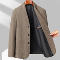 Man wearing a classic solid-colour, loose-fit wool blend coat suitable for spring and autumn.