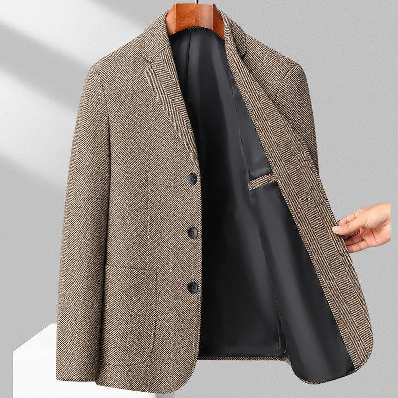 Man wearing a classic solid-colour, loose-fit wool blend coat suitable for spring and autumn.