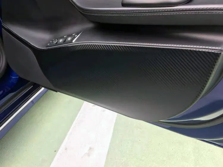 Carbon fibre pattern protective film for Tesla Model S car door interiors.