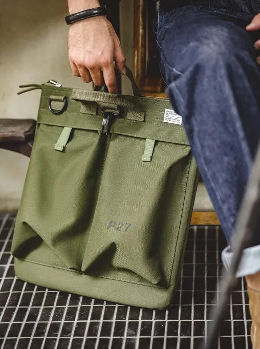 Canvas messenger bag with retro style, shoulder strap, and open showing 15-inch laptop compartment