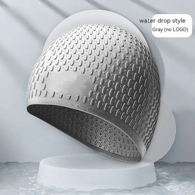 Silicone water drop style swimming cap for adults in various solid colours