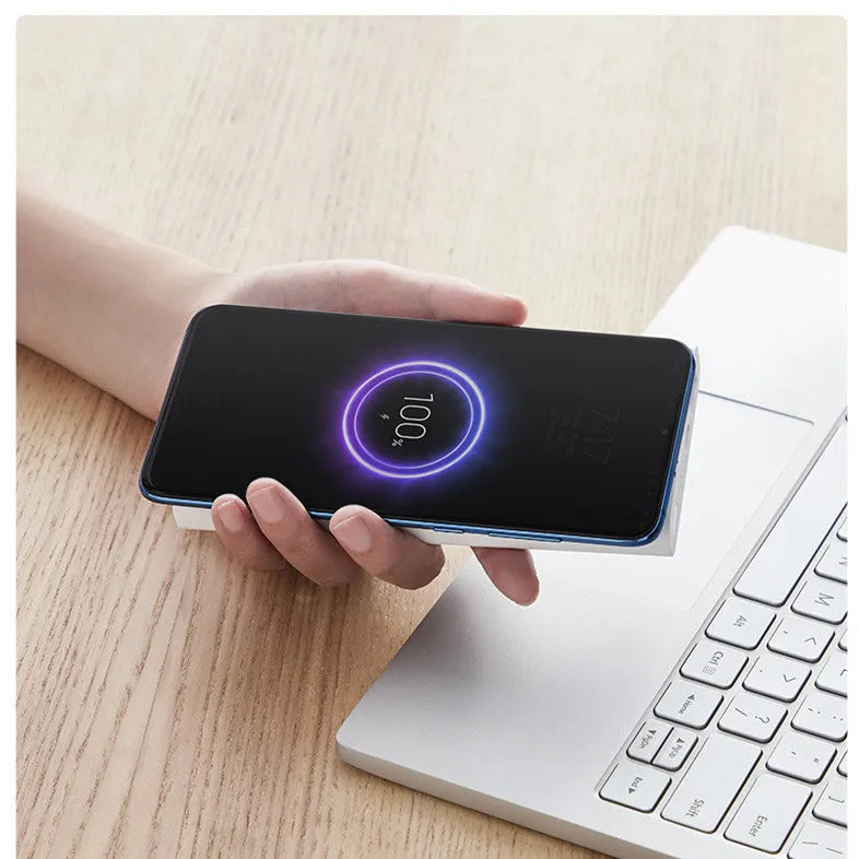 Black and white 10000mAh power bank with USB Type-C port and wireless charging capability