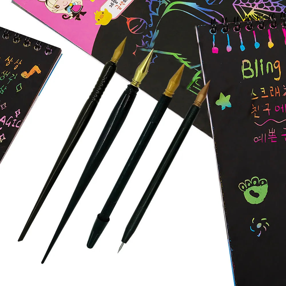 A white scratch pen tool for children's rainbow art and craft projects on a black surface.