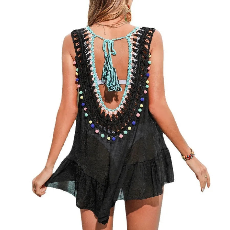 Black hand-crocheted women's beach cover-up vest with cut-out ruffles.