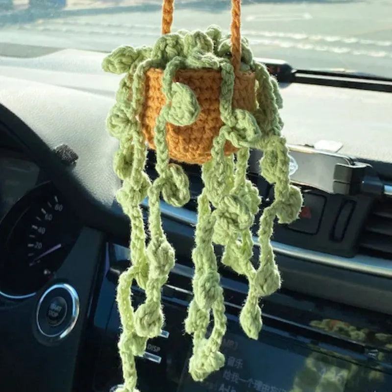 Green and white knitted wool car plant decoration with plastic base and hanging rope