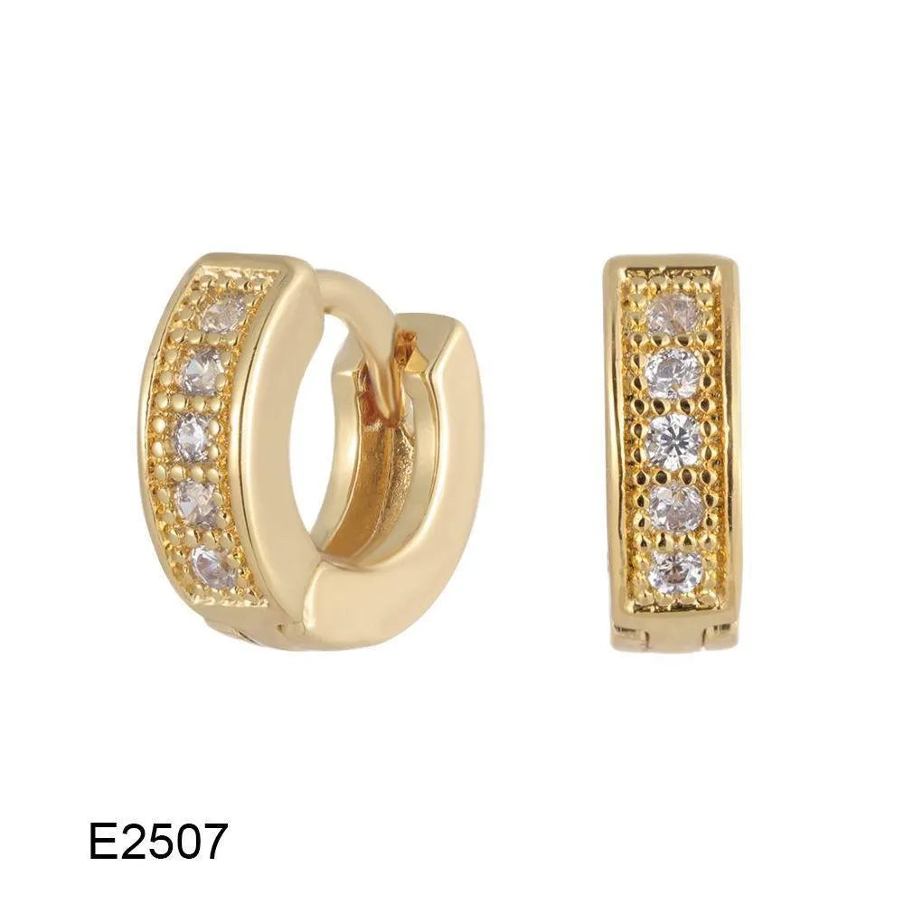Brass gold plated heart-shaped ear clip earrings with gang drill details on copper construction