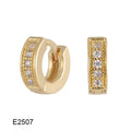 Brass gold plated heart-shaped ear clip earrings with gang drill details on copper construction