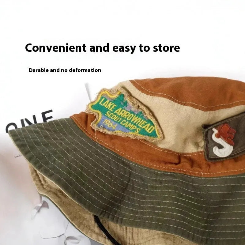 Women's army green cotton fisherman hat with hand-painted patchwork design and flat top crown