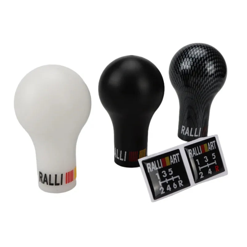 Mitsubishi car manual gear head in five colour options: white, black, carbon fibre, bright blue and luminous red