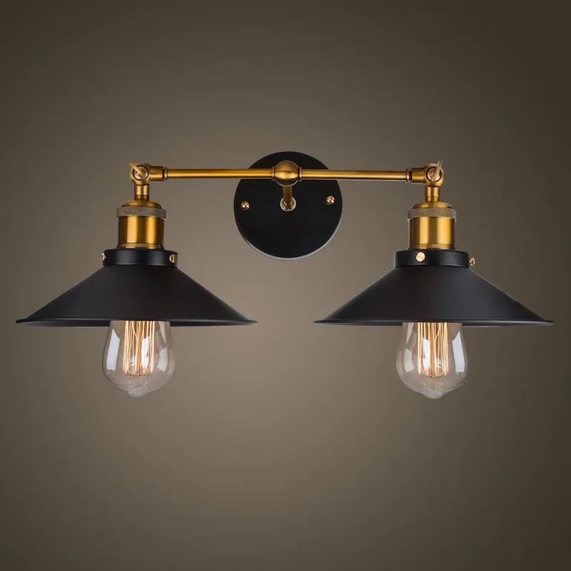 Black double head American retro industrial style iron wall lamp mounted on a wall.