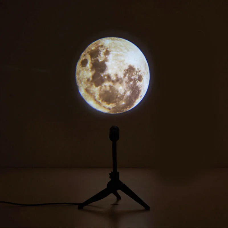 USB-powered Earth and Moon projection lamp with flexible hose bracket on a wooden table.