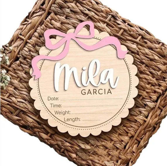 Square wooden baby ornament personalised with a custom name for nursery decor.