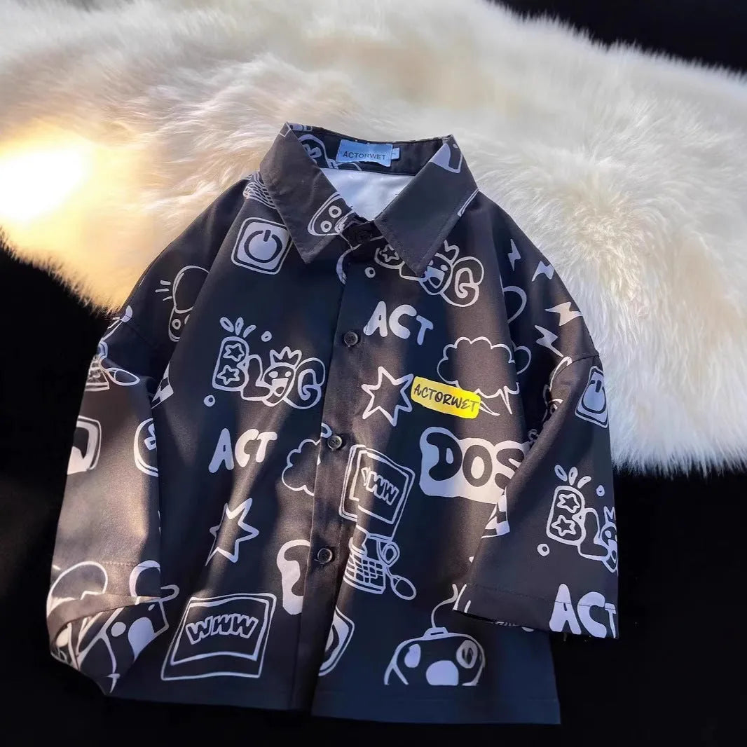 Student loose fit casual shirt with cartoon animation video game graffiti print in white or dark blue, sizes S to 2XL.