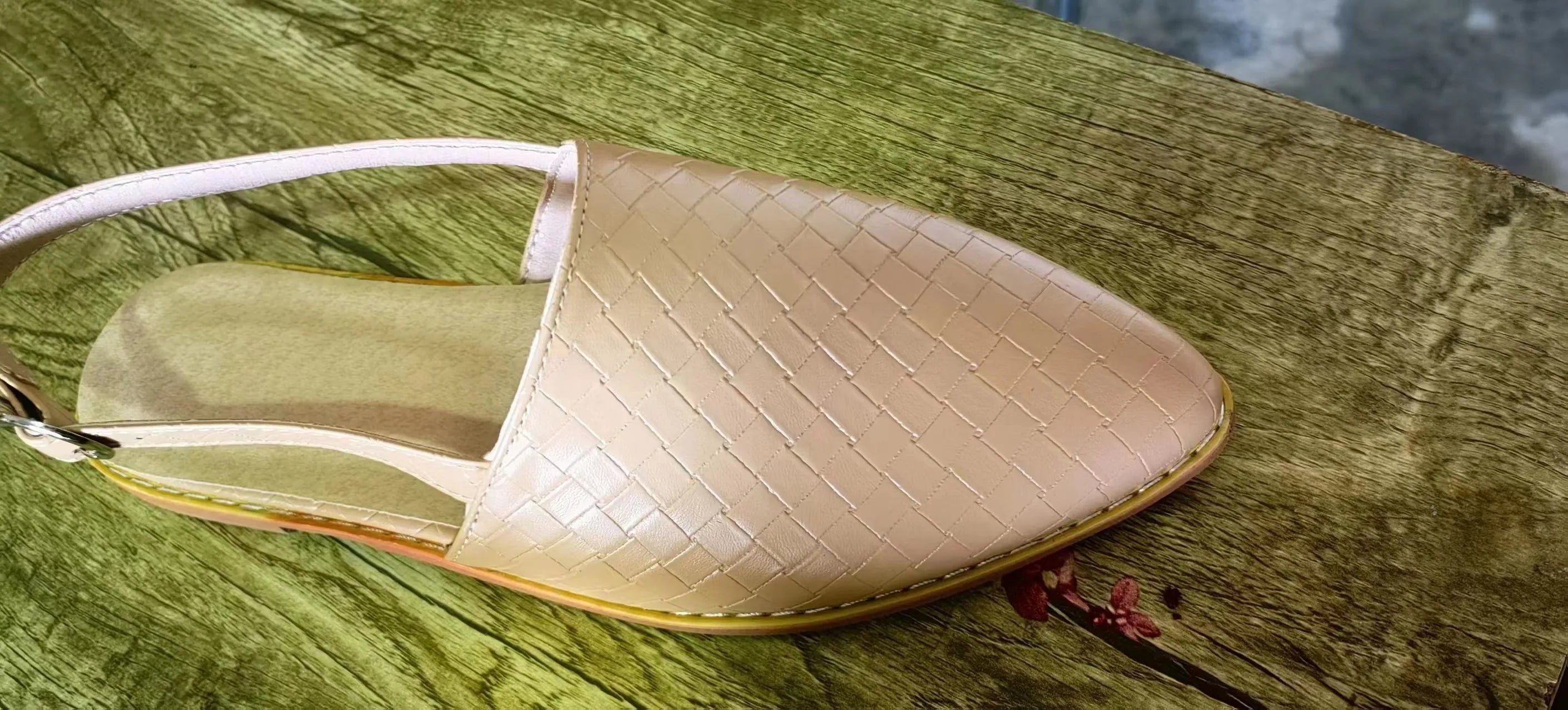 Women's flat sandals with an adjustable buckle strap and pointed toe in a selection of colours.