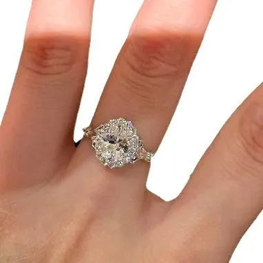 Silver adjustable diamond ring with geometric ellipse shape on finger