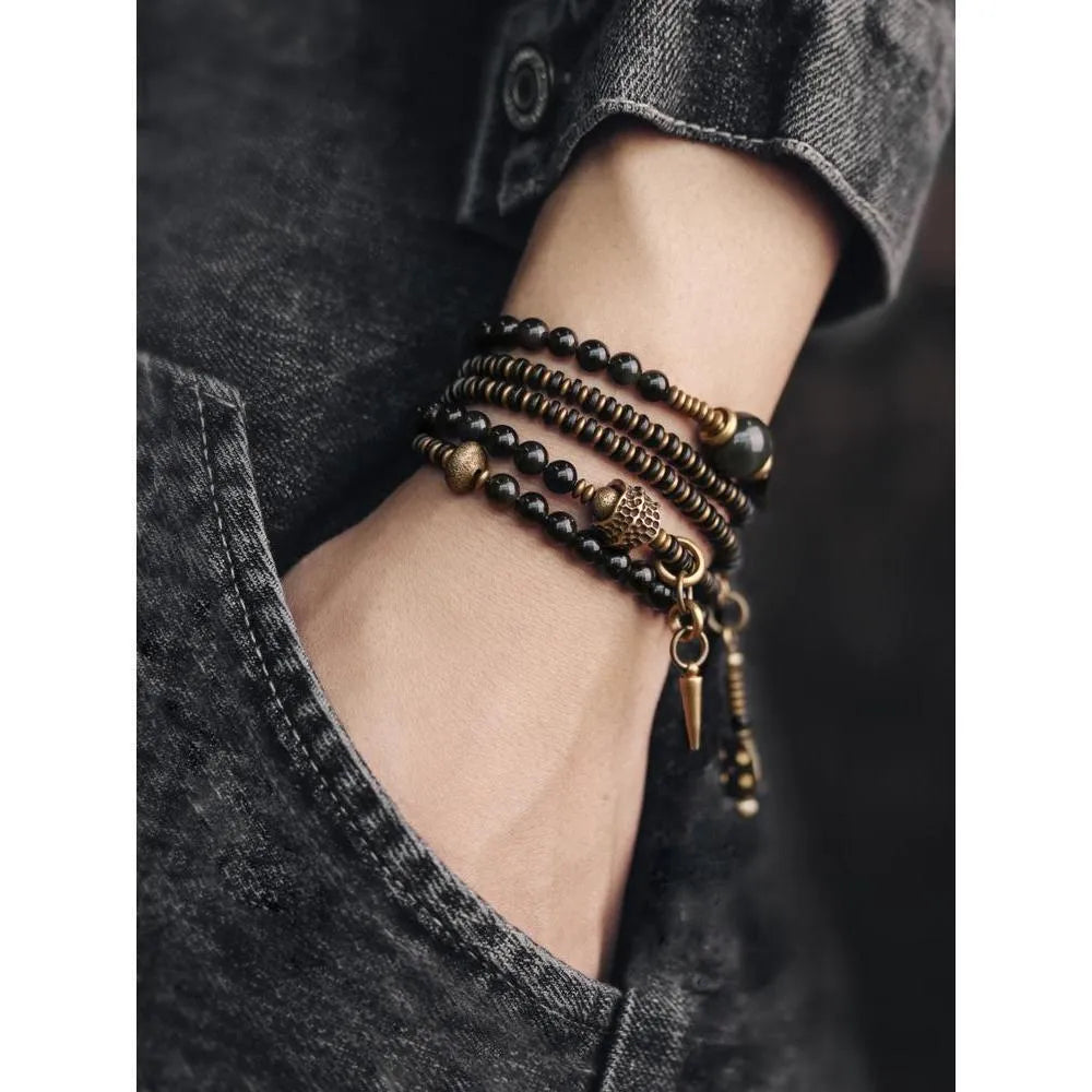 Black geometric beaded bracelet with colourful multi-layered retro design and adjustable cord