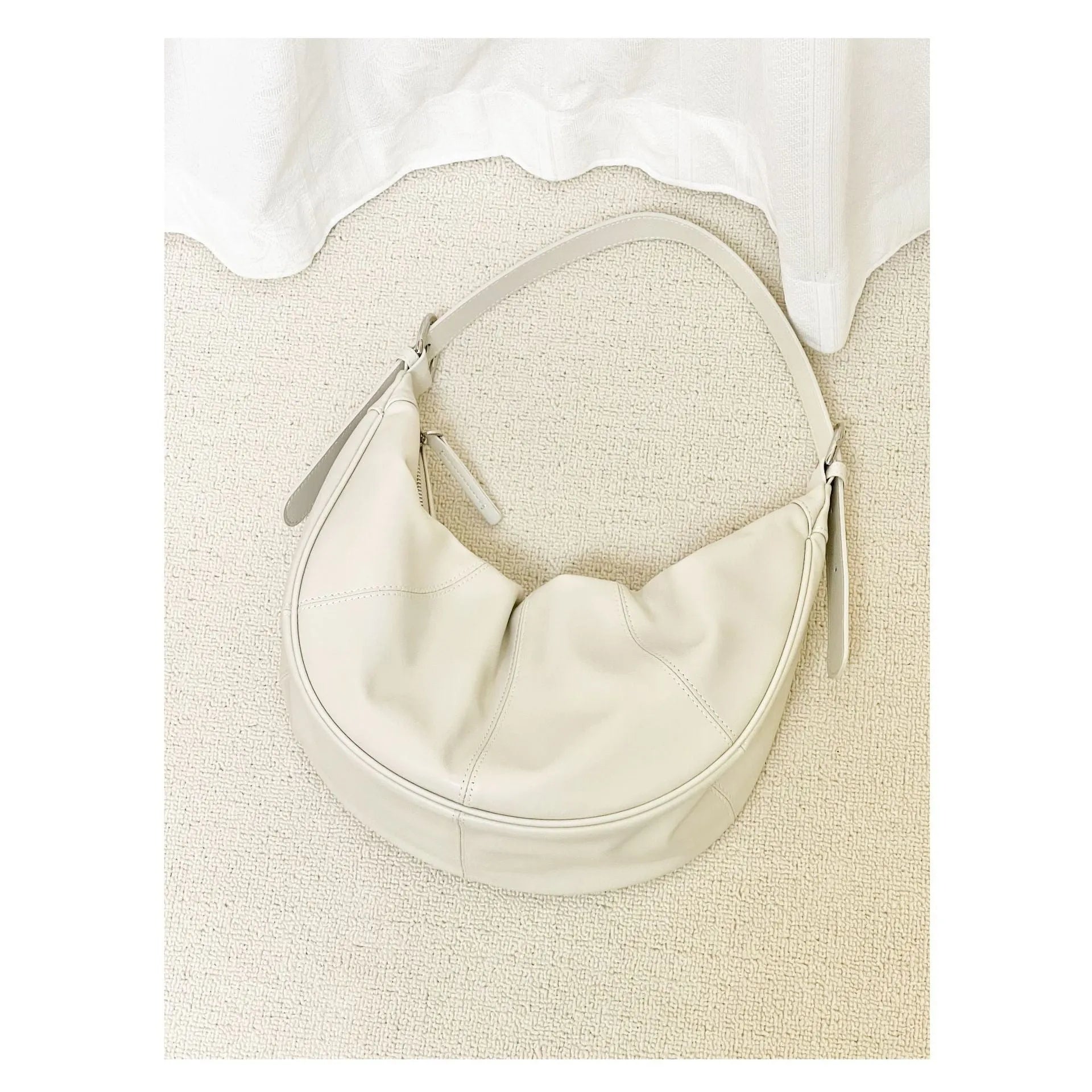 First layer cowhide shoulder bag in dumpling shape with double joint strap and sandwich pocket available in multiple colours