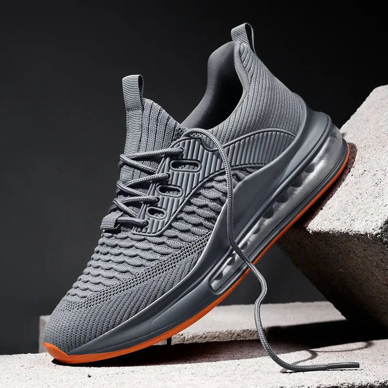 Men's low-top black breathable mesh running sneakers with white rubber sole on a solid background.