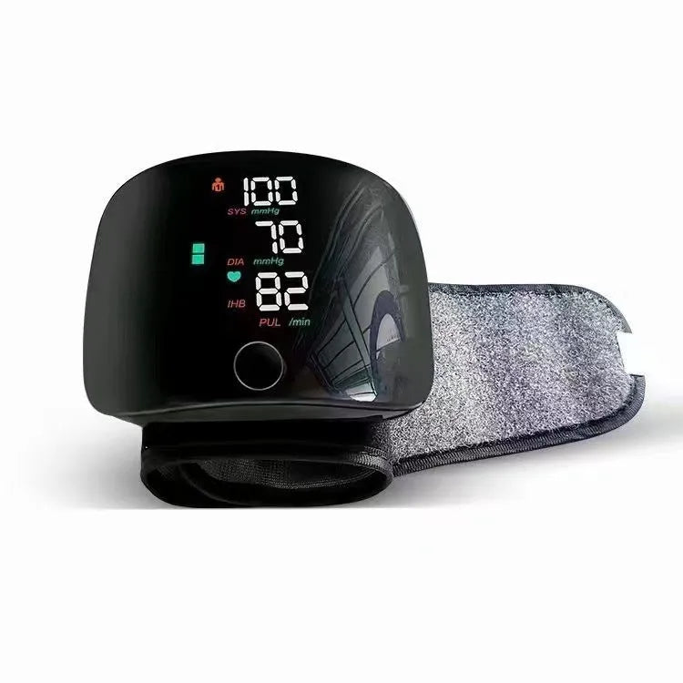 Black wrist blood pressure monitor with USB rechargeable port and digital display