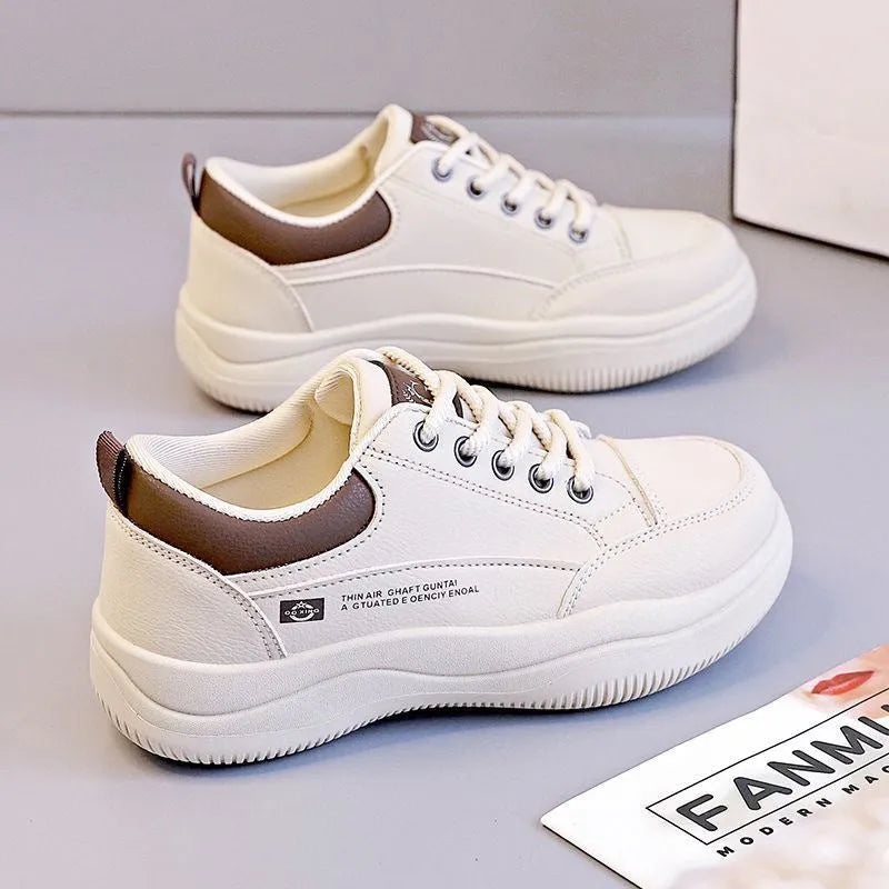 Women's white Korean-style lace-up pumps with cross straps and a round toe.