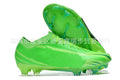 Men's low-top knitted football shoes with white sole and black upper, showing FG studs.
