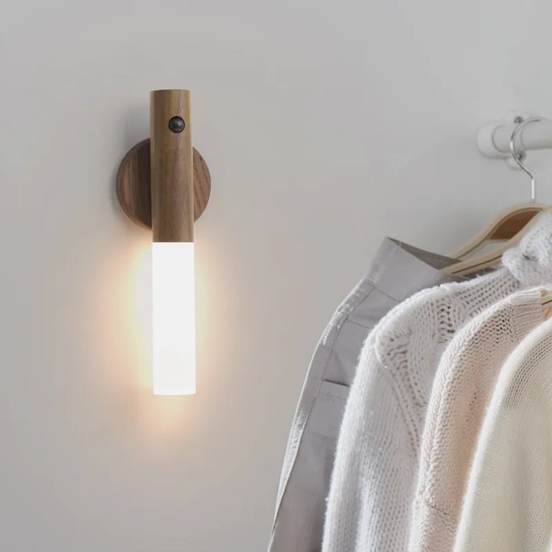 Smart sensor LED desk lamp in solid wood and acrylic on a desk, showing compact size and modern design.