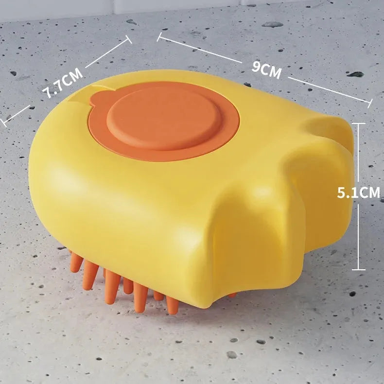 Blue pet bath brush with integrated shampoo box for washing cats and dogs.