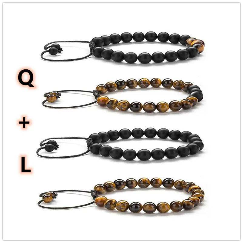 Matte black tiger eye agate couple bracelets with geometric beads on a neutral background.