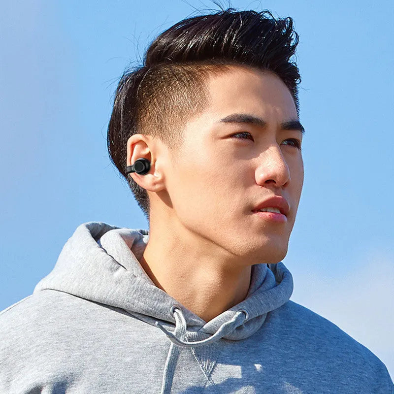 Black wireless Bluetooth headset with clip-on bone conduction design for exercise