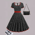 Multicolour polka dot pleated dress with square collar and short sleeves.