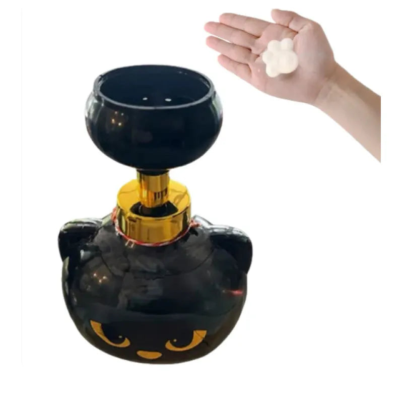 Black cartoon cat shaped plastic foam soap dispenser on bathroom counter